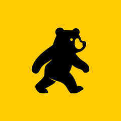 Simple black silhouette of a walking bear on a yellow background