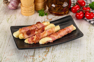 Hot mozzarella sticks with bacon