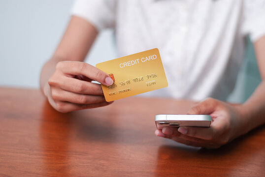 Online shopping action payment with credit card home office digital interaction casual setting modern payment concepts
