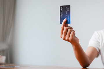 Making a payment with a credit card home office digital content indoor close-up financial management