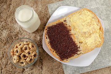 Bread with chocolate choco rice and butter with milk and snack for breakfast	
