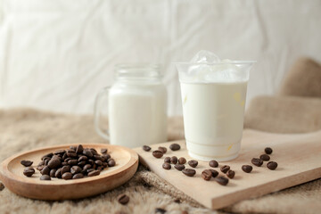 Delicious iced coffee, mocca, and chocolate drinks with coffee beans on white wooden table