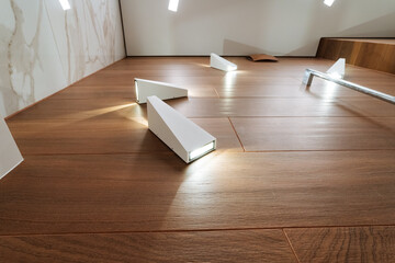 A beautiful and carefully crafted wooden floor adorned with a few strategically placed lights...