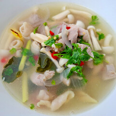 Savory Soup: A vibrant close-up of a steaming bowl of savory soup, brimming with fresh ingredients....