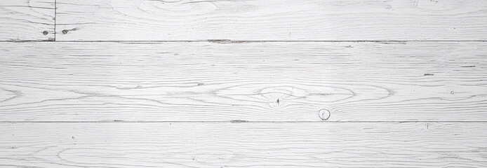 Warm daylight reveals imperfections across white-painted timber, giving depth to the smooth lines and delicate surface cracks.