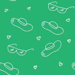 Seamless Pattern With Sunglasses, Hats, and Hearts on a Green Background