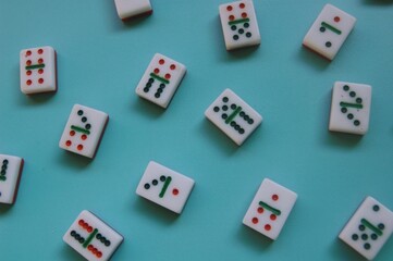 Domino tiles on blue background. Dominoes are a great game for kids, offering numerous...