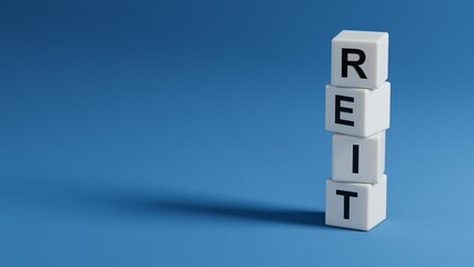 Word reit on wooden elements with copy space.close up of wooden elements,Business Concept.3D rendering on blue background.