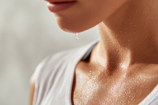 Close up of summer sweat drop on collarbone glistening skin healthy young woman warm sunlight fitness freshness and natural beauty evoking sense of vitality