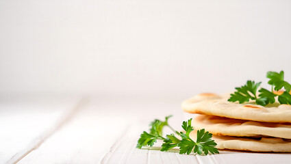 Soft Wheat Flatbreads with Parsley on White Wood naan