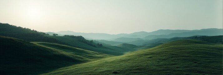 Misty emerald waves of rolling hills bask under a muted sunrise, evoking Beltane's renewal and Earth Day's tranquility