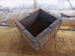Rustic Wooden Box on Distressed Timber Surface