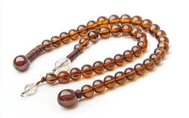 A crystal tasbih with intricate spacer beads used for remembrance of Allah Isolated on white Background