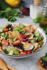 A bowl with Fattoush - Traditional Levantine salad