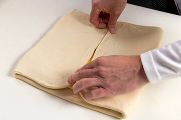Pastry chef makes puff pastry.