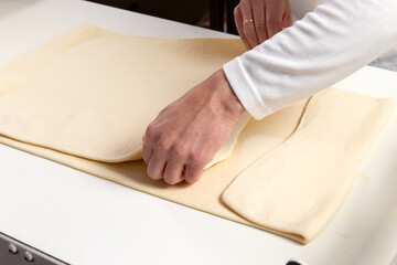 Pastry chef makes puff pastry.