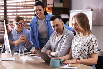 Marketing. Team of businesspeople working together at desk in office