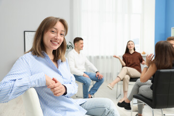 Group of people having meeting during life coaching class indoors, selective focus