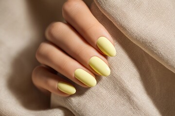 Bright Yellow Manicure Rests Elegantly on Soft Linen Fabric Generative AI