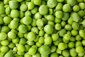 Pile of fresh green peas as background, top view
