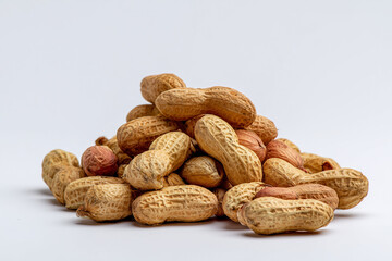 a pile of peanuts on a white background
