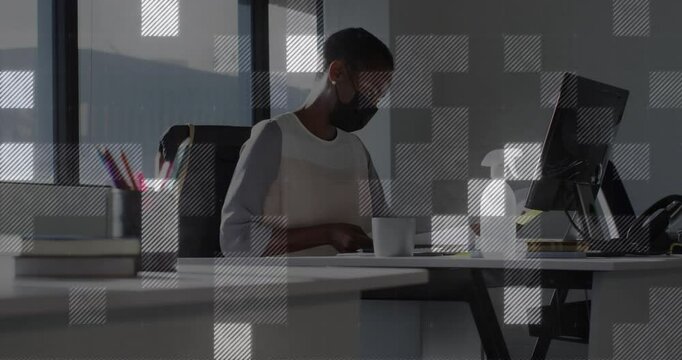 Business worker flipping forms, typing on keyboard and sipping coffee showing grid overlay