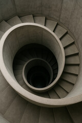 Fototapeta premium Architectural Spiral: Minimalist Concrete Staircase from Above