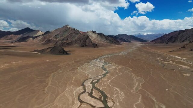 Aerial view above Pamir Mountains in Tajikistan riding on famous Pamir highway scenic landscape 
