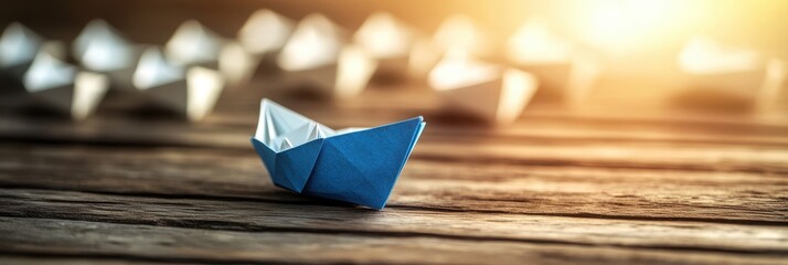 Vintage Leadership: A Blue Paper Vessel Navigating a Fleet of White Crafts Guided by a Compass Symbol on Sunlit Wood