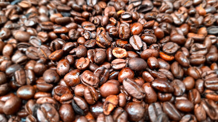 Roasted Coffee Bean Cascade: An inviting mountain of freshly roasted coffee bean, a tantalizing aroma and richness texture, promising an exceptional cup.
