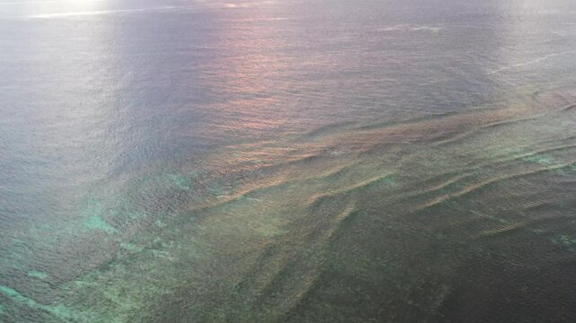 Pacific ocean sea surface vertical panorama to setting sun in Fiji at Tokoriki island 4k.
