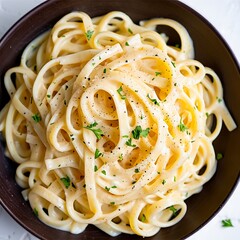 Creamy fettuccine alfredo pasta dish in bowl