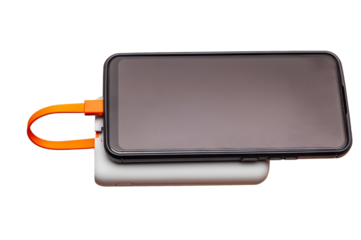 A smartphone on a power bank, connected by an orange cable against a white backdrop.