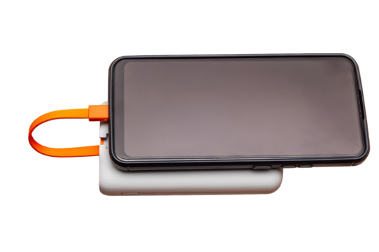A smartphone on a power bank, connected by an orange cable against a white backdrop.