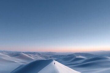 Lone hiker walking on sand dune ridge at sunset in desert landscape