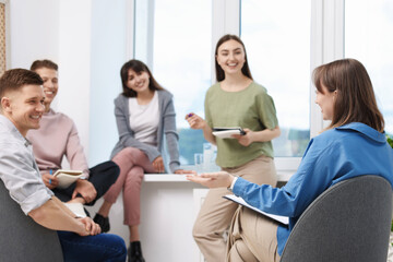 Group of people having meeting during life coaching class indoors