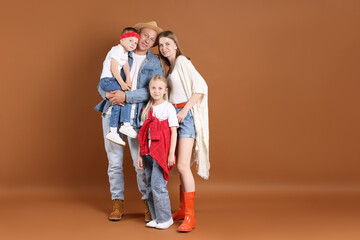 Happy family on light brown background. Space for text