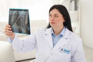 Doctor examining neck MRI scan in clinic