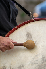 traditional frame drum with red rim and white ropes, authentic traditional music and percussive instrument