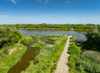 The road to the old disused ferry crossing over the Vistula River in the village of Borki, Masovia,...