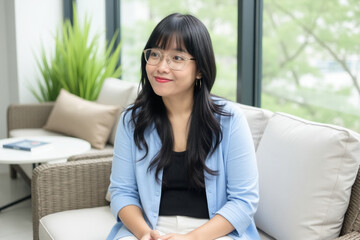 Full length portrait of smiling female relaxing at home