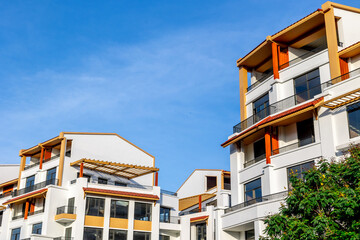 Modern apartment buildings with blue sky background