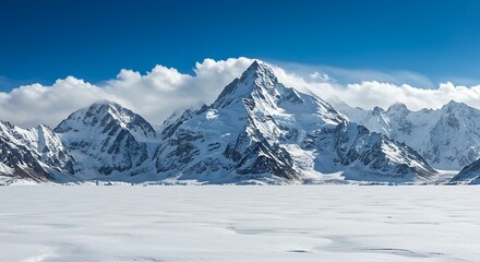 Fototapeta premium Majestic Snow Capped Mountains Under a Clear Blue Sky