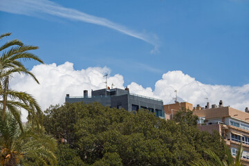 Weather image with cumulus clouds gathering.  Meteorological image depicting rain bearing clouds. 