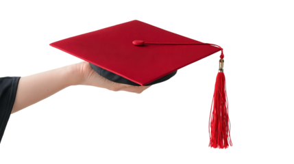 Education's Pinnacle: A close-up view captures a graduate's hand, gracefully holding a vibrant red graduation cap, symbolizing achievement and new beginnings.