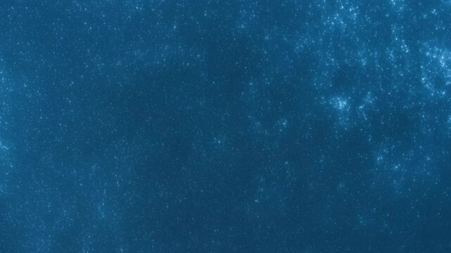 Dark blue backdrop speckled with bright dots clustered to the right