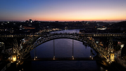 Sunset Dom Luis I Bridge At Porto In District Of Porto Portugal. Sunset Skyline Scene. Illuminated...