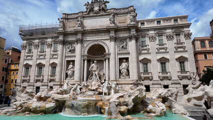 Trevi Fountain At Rome In Lazio Italy. Medieval Sculpture Scenery. Famous Fountain. Trevi Fountain At Rome In Lazio Italy. Cultural Heritage Skyline. Downtown Cityscape. Rome Skyline.