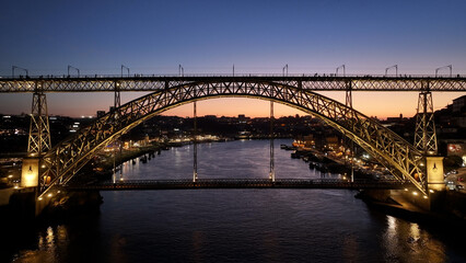 Sunset Dom Luis I Bridge At Porto In District Of Porto Portugal. Sunset Skyline Scene. Illuminated...
