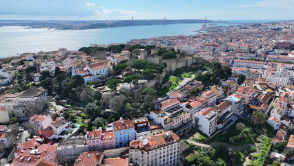 Fototapeta premium Sao Jorge Castle At Lisbon In Lisbon District Portugal. Medieval Castle Scenery. Ancient Cityscape. Sao Jorge Castle At Lisbon In Portugal. Historical City Landscape. Tourism Travel Destination.